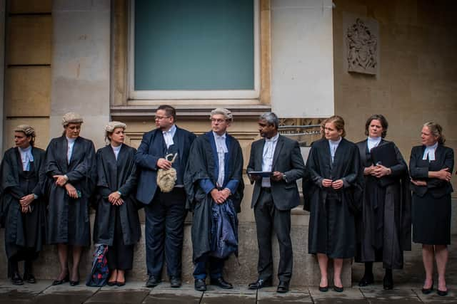 Criminal barristers begin strike action outside of Bristol Crown Court.