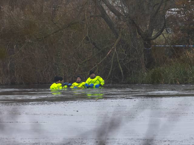 Rescue teams searching the freezing lake in Solihull for survivors.