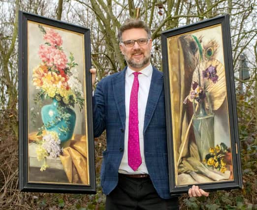 Charles Hanson, owner of Hansons Auctioners, with Queen Victoria’s paintings.  