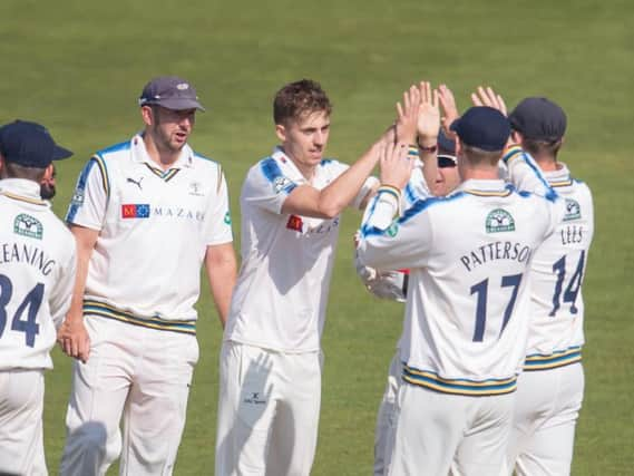 Ben Coad celebrates with his Yorkshire teammates (Photo: SW Pix)