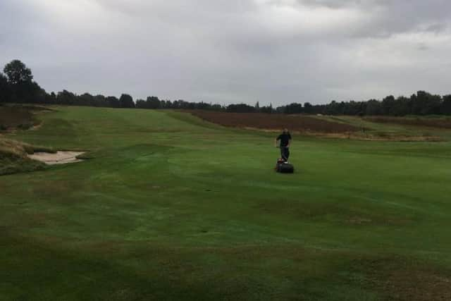 Final preparations for the Yorkshire Challenge at Moortown ahead of the first round with hand-mowing of the 12th green prior to use of the turf iron.