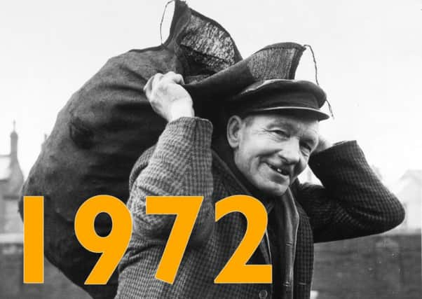 Putting a happy face on the fuel crisis is 61-year-old coalman Arthur Tate  loading bags of smokeless fuel at the British Fuel Supply Depot in Armey, Leeds, in 1972.