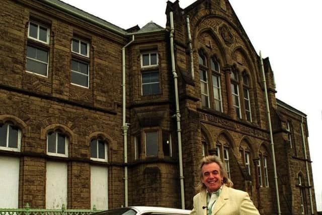 Nightclub owner Peter Stringfellow visiting his old school Pye Bank  Nursery and Infant school in Sheffied.