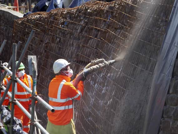 Contractors undertaking the work to stabilise the wall below the A59 at Kex Gill