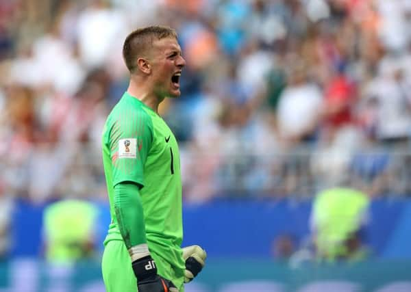 England goalkeeper Jordan Pickford celebrates after team-mate Harry Maguire scores his side's first goal of the game against Sweden. Picture: Tim Goode/PA