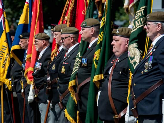 Standard bearers at today's service to mark the Bligny campaign in the First World War.