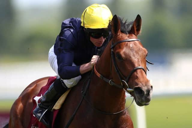 Sir Michael Stoute's King George hope Crystal Ocean winning at Newbury earlier this season. Jockey Ryan Moore is replaced by William Buick today.