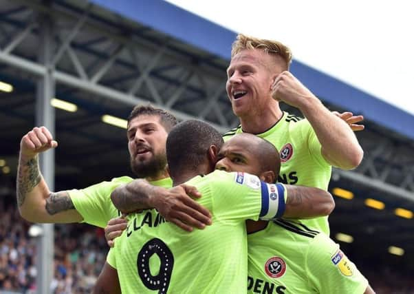 Winner: Sheffield United celebrate David McGoldrick's winning penalty