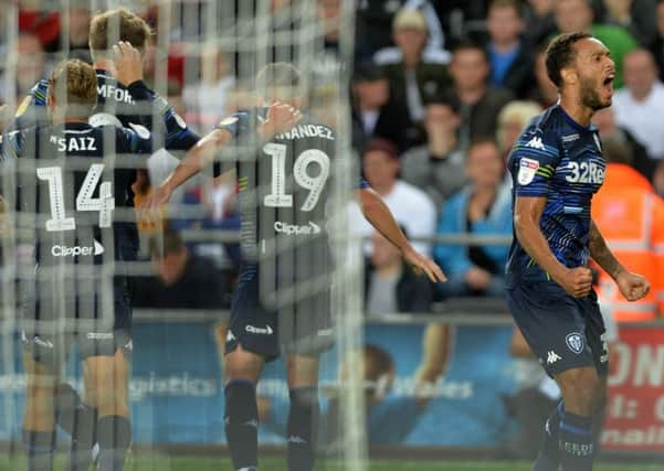 Lewis Baker yells at the visiting fans as Leeds United players celebrate Pablo Hernandezs point-winning goal against Swansea City (Picture: Bruce Rollinson).