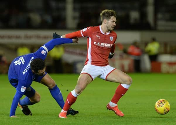 Tom Bradshaw, right, has moved from Barnsley to Millwall (Picture: Bruce Rollinson).