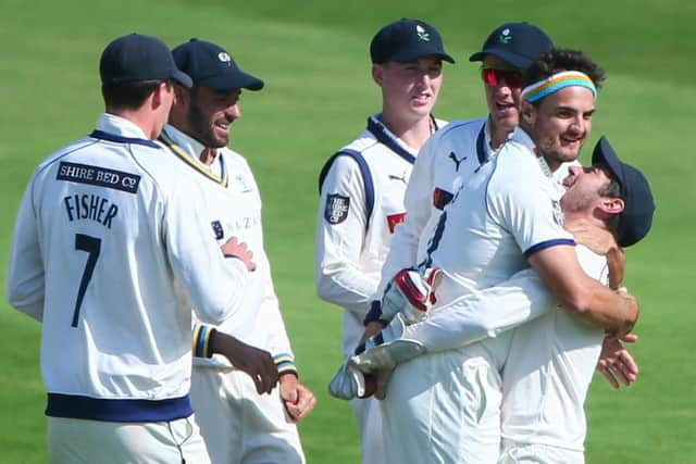 Yorkshire's Jack Brooks celebrates with Andrew Hodd after taking the wicket of Somerset's Tom Abell. (Picture: Alex Whitehead/SWPix.com)