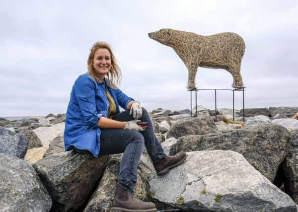 ANIMAL MAGIC: Emma Stothard with her polar bear. PIC: Tony Bartholomew