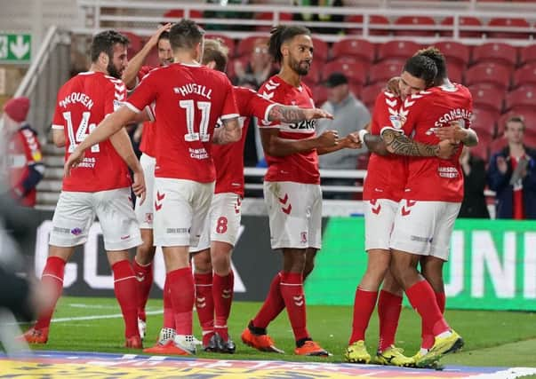 Middlesbrough's Britt Assombalonga (right) is mobbed by team mates after scoring his side's second goal.