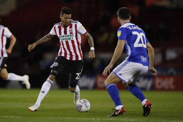 Sheffield United's Marvin Johnson  takes on Birmingham City's Gary Gardner. Picture: Simon Bellis/Sportimage