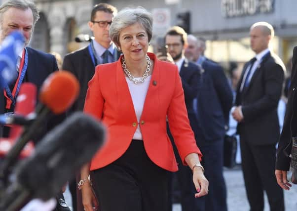 Theresa May arrives in Salzburg.