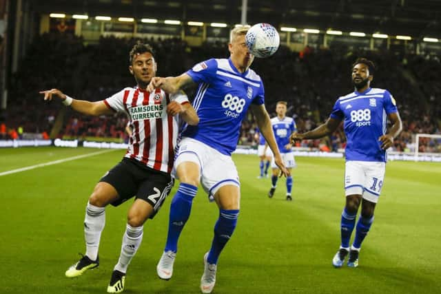 George Baldock of Sheffield Utd pressures Kristian Pedersen of Birmingham City