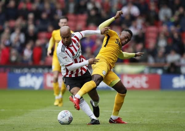 Sheffield United's David McGoldrick battles with Preston's Darnell Fisher of at Bramall Lane. Picture: Simon Bellis/Sportimage