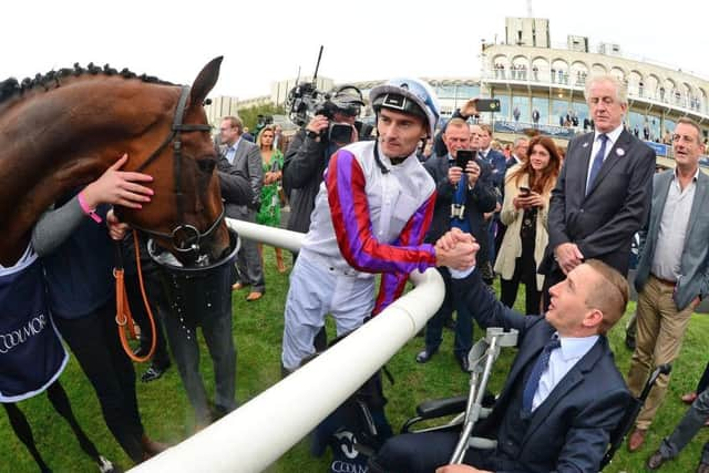 Super-sub jockey Daniel Tudhope congratulates the injury sidelined PJ McDonald after Laurens won the Matron Stakes - the type of sportsmanship synonymous with racing.