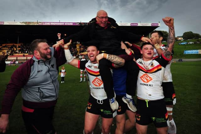 Bradford Bulls' George Flanagan and Jordan Lilley chair coach John Kear off the field after winning the League 1 Play-Off final. (Simon Hulme)