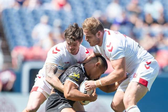 MAKING IT COUNT: John Bateman, left, and Thomas Burgess tackle New Zealand's Jamayne Isaako in Colorado. Picture by Allan McKenzie/SWpix.com