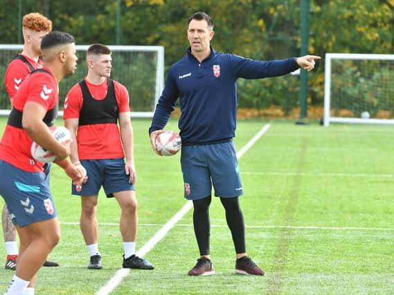 Kruise Leeming, left, taking advice from England Knights assistant coach Paul Sculthorpe at training in Leigh (Simon Wilkinson/SWPix)