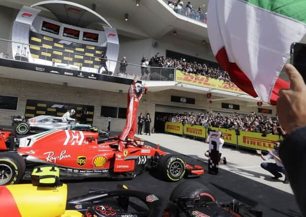 Ferrari driver Kimi Raikkonen celebrates after winning the US Grand Prix in Austin, Texas. (AP Photo/Darron Cummings)