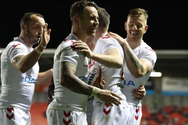 England's Richie Myler (centre) celebrates his try against France.