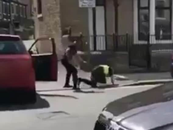 A still from the footage in which the police officer was attacked by a drug addict