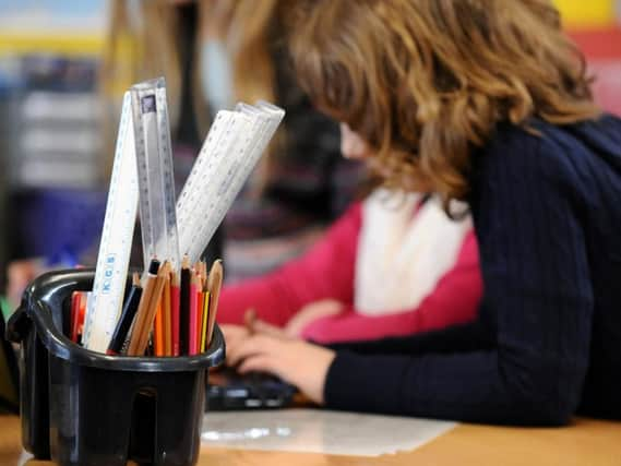 Primary School children at work in a classroom. Pic credit: PA/Dominic Lipinski