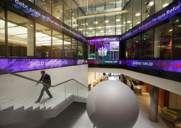 A view of the information screens at the London Stock Exchange in the City of London which show the FTSE 100 index. London's leading shares index sustained more heavy losses today as the turmoil engulfing world markets showed no signs of easing  PRESS ASSOCIATION Photo. Picture date:Friday August 05, 2011.  The FTSE 100 Index opened more than 2.5% lower - off 140 points at 5253 - amid investor panic over the deepening eurozone debt crisis and health of the US economy. See PA story CITY Markets. Photo credit should read:Yui Mok/PA Wire