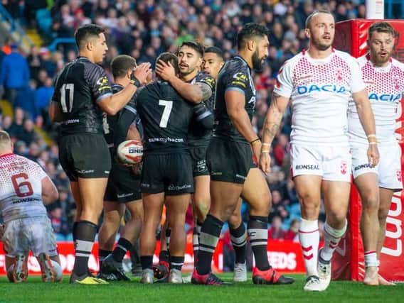 New Zealand's Kodi Nikorima is congratulated on scoring a try against England. (Allan McKenzie/SWpix.com)