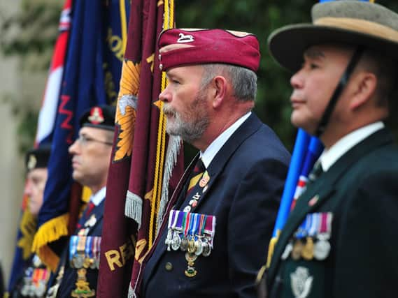 Standard bearers look on as Leeds commemorates Remembrance Day.