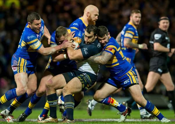 Leeds's Brett Ferres, Keith Galloway & Brett Delaney tackle North Queensland's Kane Linnett back in February 2016. Picture: Allan McKenzie/SWpix.com