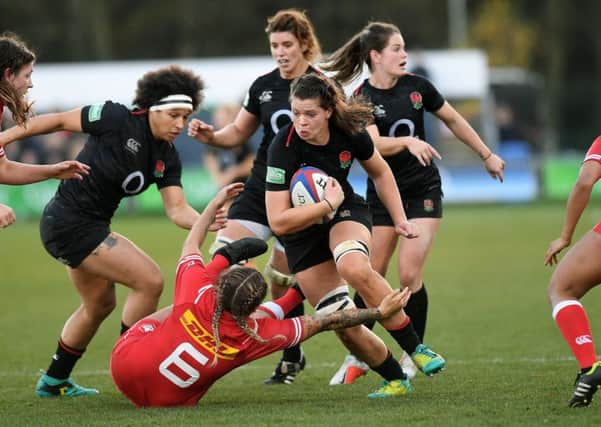 England's Abbie Scott gets away from Canada's Gabrielle Senft.
 Picture: Jonathan Gawthorpe.