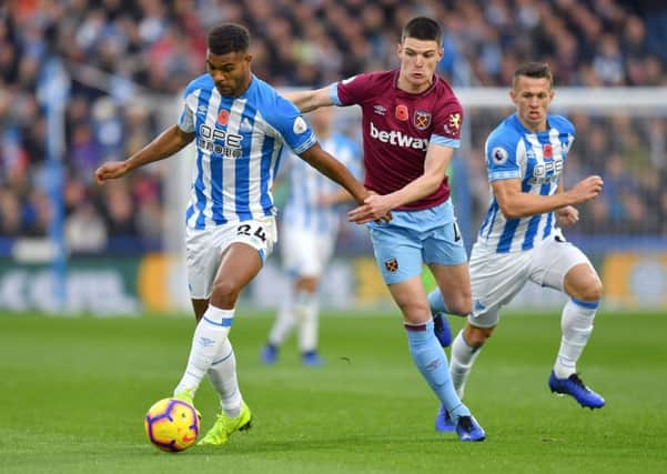 Backed: Huddersfield Town's Steve Mounie, left.