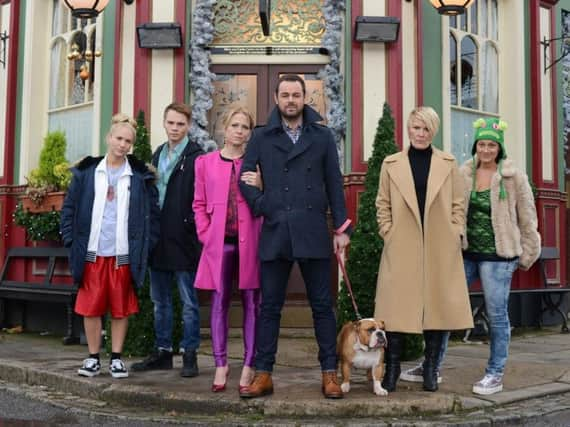 Cast members outside the Queen Vic in Walford