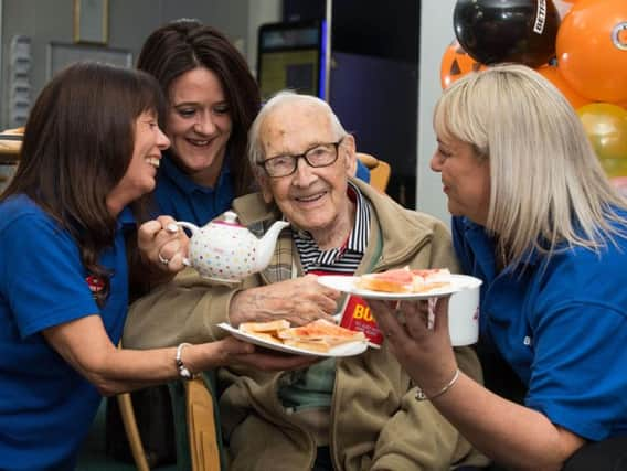 Jim Tasker pictured with with Betfred staff (from left) Lorraine, Helen and Wendy.