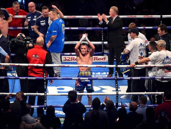 Josh Warrington celebrates following title defence against Carl Frampton.