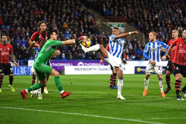 Southampton's Alex McCarthy saves from Huddersfield Town's Mathias Jorgensen. Picture: Gareth Copley/Getty)