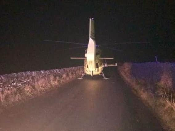 The air ambulance landed in this narrow country lane in complete darkness