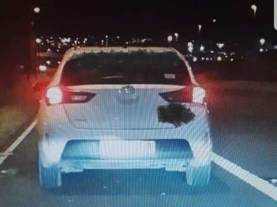 The car pulled over by West Yorkshire Police. Photo: @WYP_RPU/Twitter