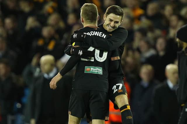 Victory: Hull's two-goal hero Jarrod Bowen is mobbed by Robbie McKenzie at the full-time whistle.