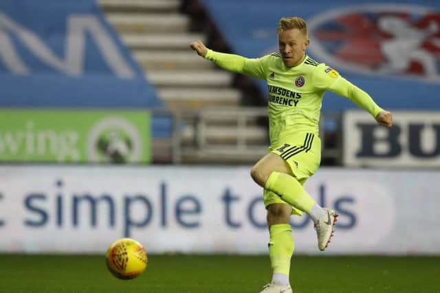 ON TARGET: Mark Duffy scores Sheffield United's second goal against hosts Wigan at the DW Stadium. Picture: Simon Bellis/Sportimage