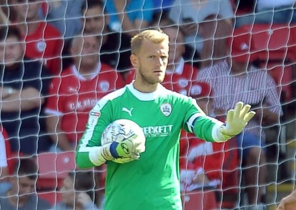 SOLID: Goalkeeper Adam Davies was called on to make a number of save at Luton Town Picture: Tony Johnson.