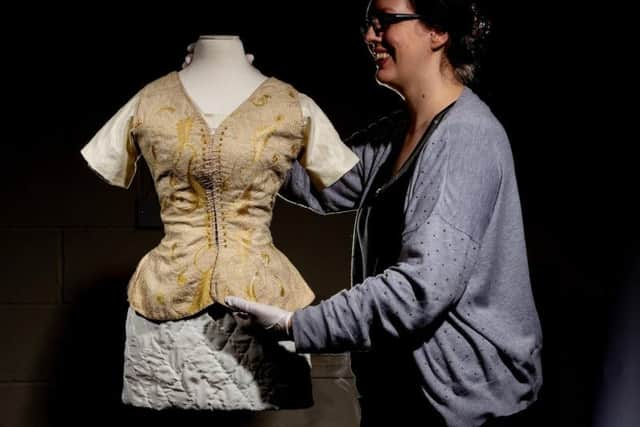 Dr Faye Prior prepares pieces for display in the Shaping the Body exhibition at York Castle Museum.