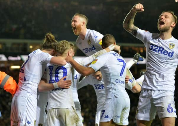 Jack Harrison celebrates his goal with Ezgjan Alioski.