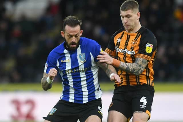 Sheffield Wednesday's Steven Fletcher takes on Hull's Jordy de Wijs.
(Picture: Jonathan Gawthorpe
)