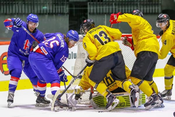 Harry Gulliver battles to get the puck through on the Lithuanian goal. Picture courtesy of Hendrik Soots.