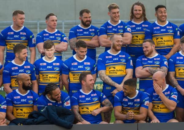 Kallum Watkins and his leeds Rhinos team-mates share a joke during today's annual team photocall at Headingley.