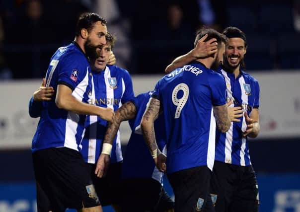 Sheffield Wednesday players celebrate after Atdhe Nuhiu, left, scored the only goal of the game in their FA Cup third-round replay against Luton Town at Kenilworth Road (Picture: Steve Ellis).